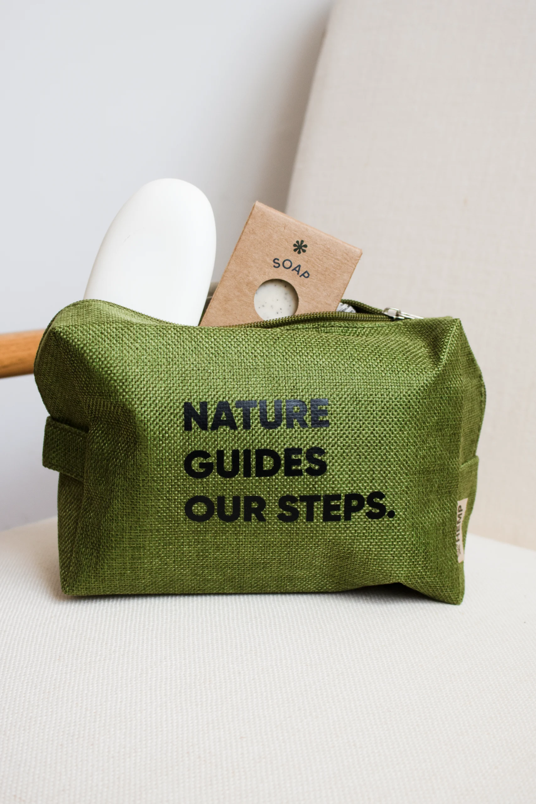 Personalized green toiletry bag with black text