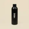 Botella térmica color negro NORMA Frontal Botella térmica color negro personalizada con logo fondo beige