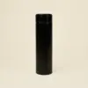 Termo acero inoxidable negro fondo beige