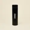 Termo acero inoxidable personalizado negro con logo blanco fondo beige