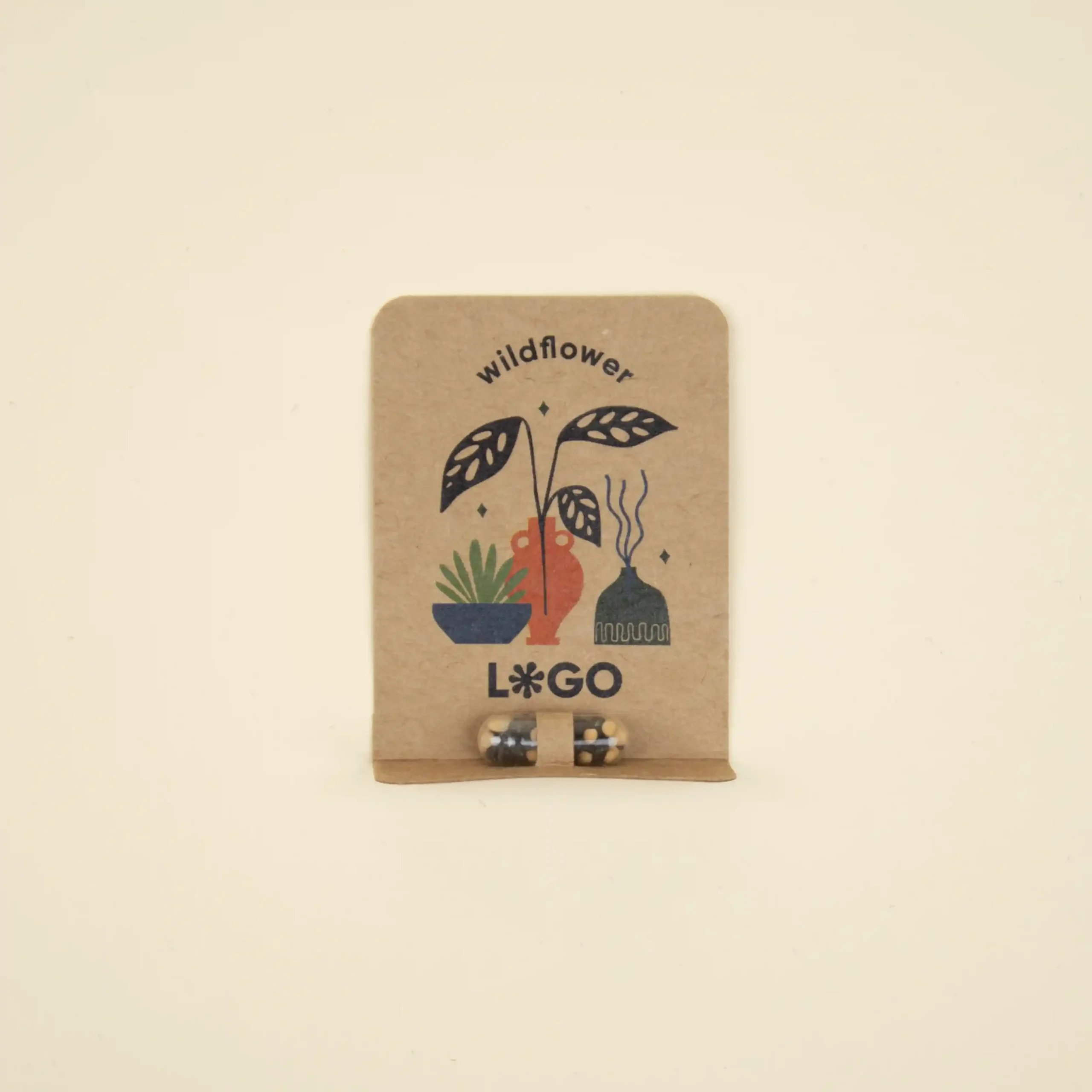 Cápsula biodegradable con semillas en su interior con packaging de cartón kraft personalizado