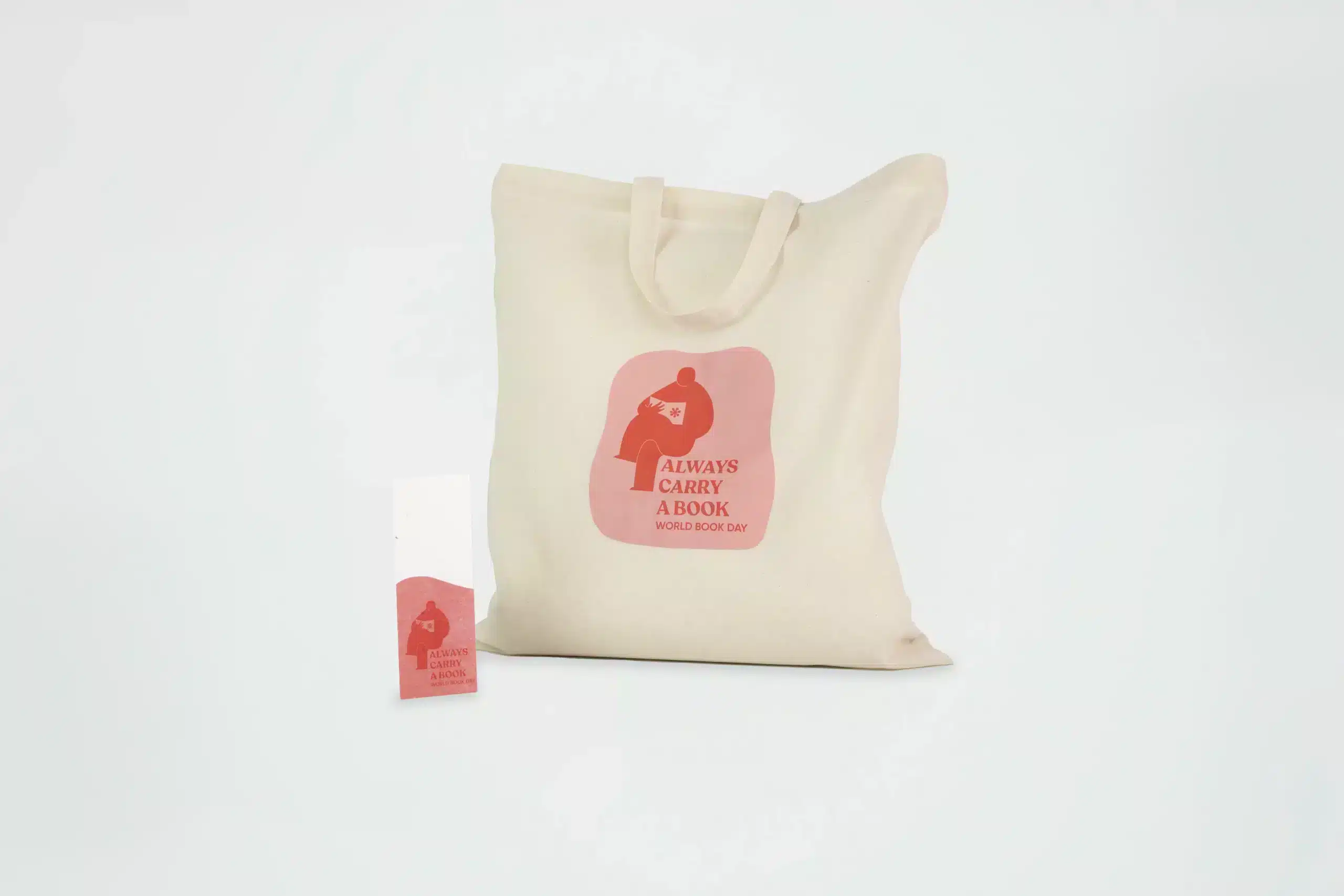 A cotton tote bag and a plantable bookmark, both personalised with World Book Day themed designs