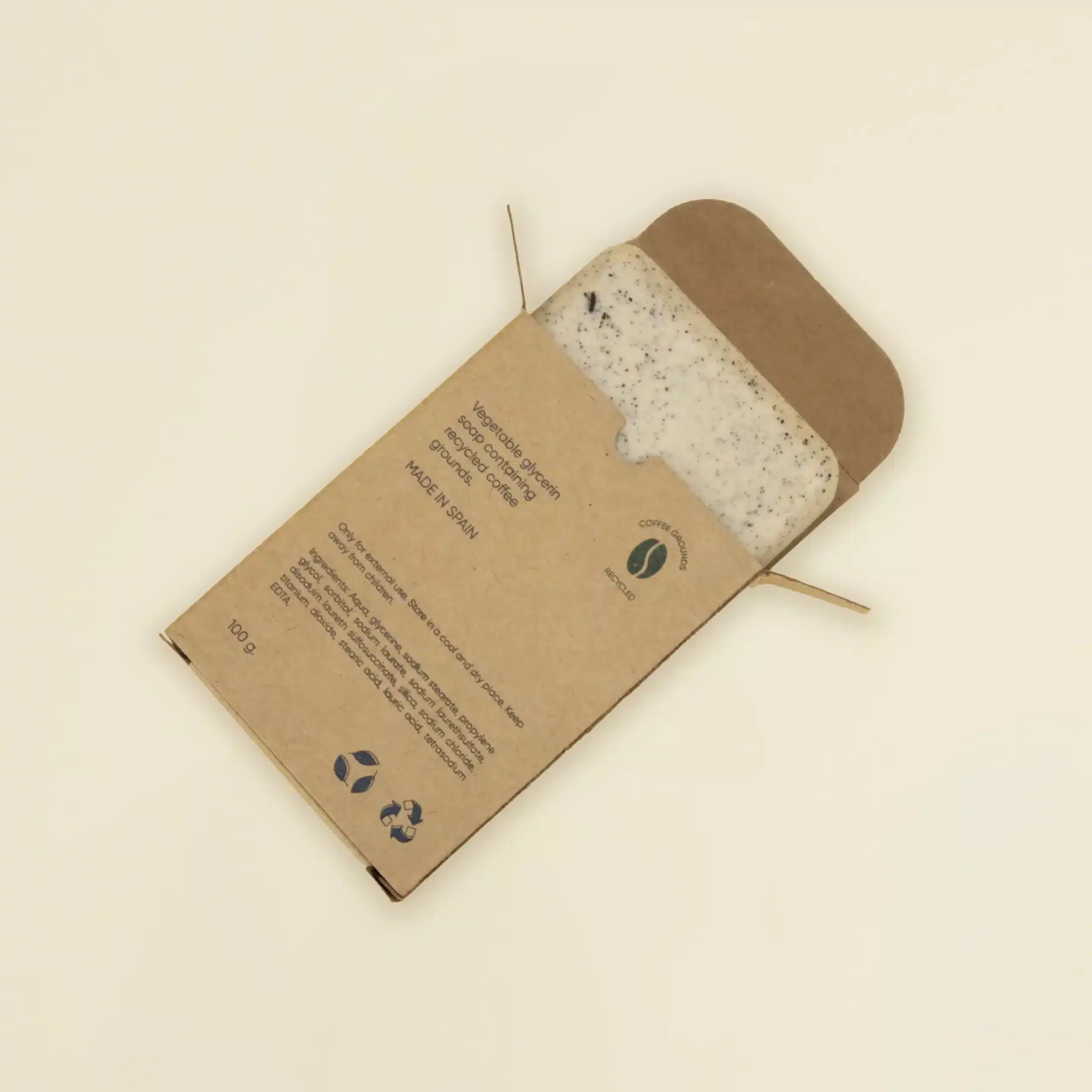 Jabón artesanal dentro una caja marrón kraft personalizada abierta